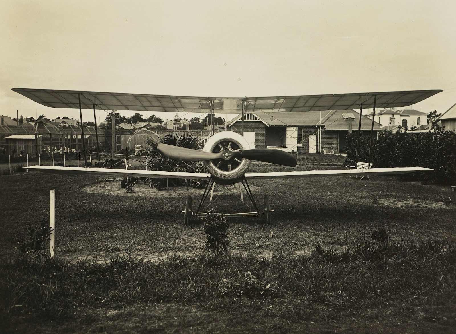 A vintage 1930s propeller airplane, representing the era of the original eight flight attendants