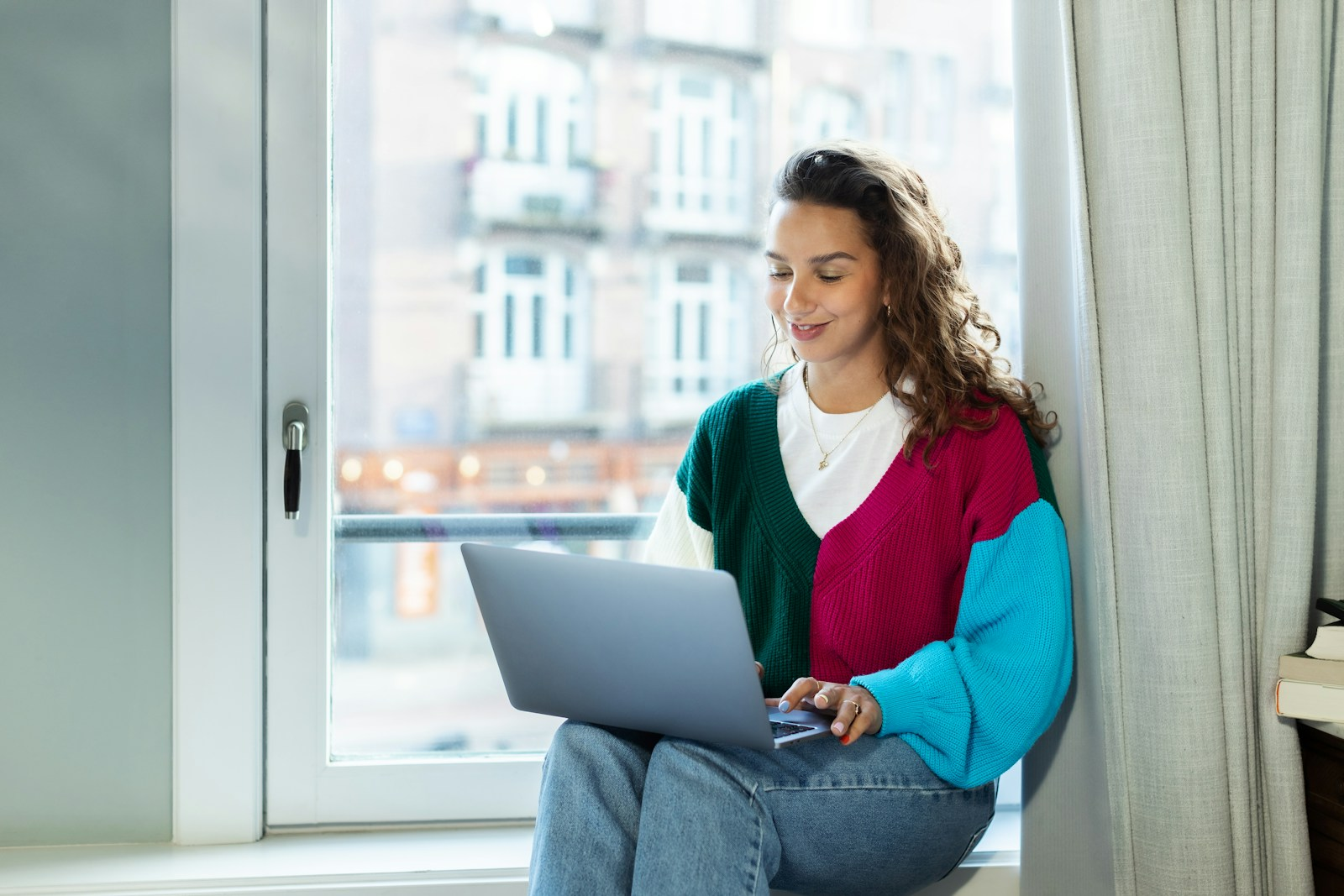 A freelancer working from a laptop at home, representing the opportunity to explore different career paths through freelance work